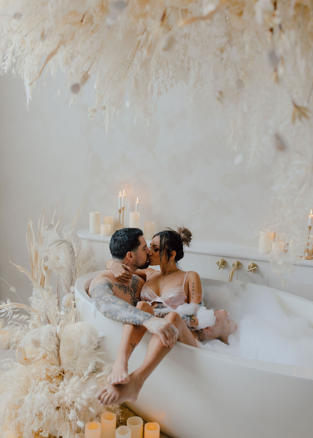 Toronto couple in a bath getting cozy at the Mint Room Studios Sanctuary set up