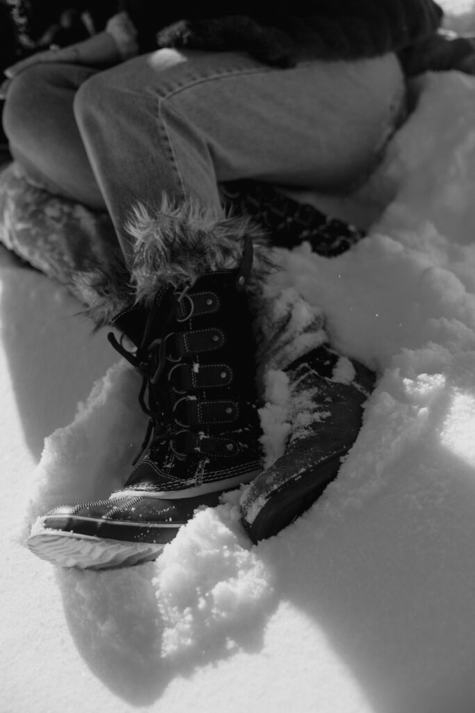 Close up of feet standing in the snow