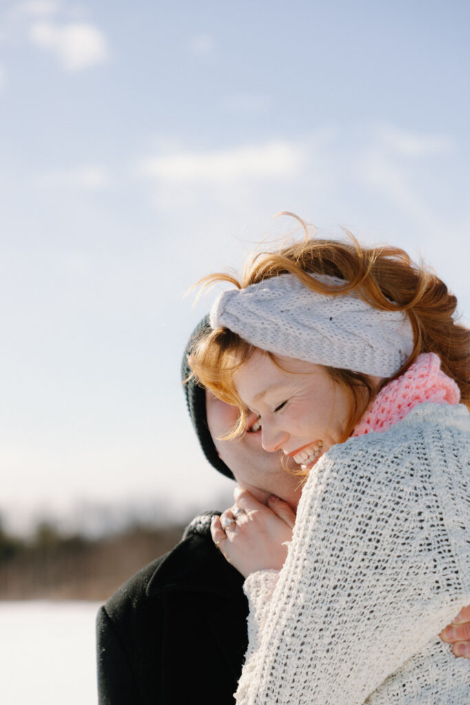 Close up of woman smiling in the snow