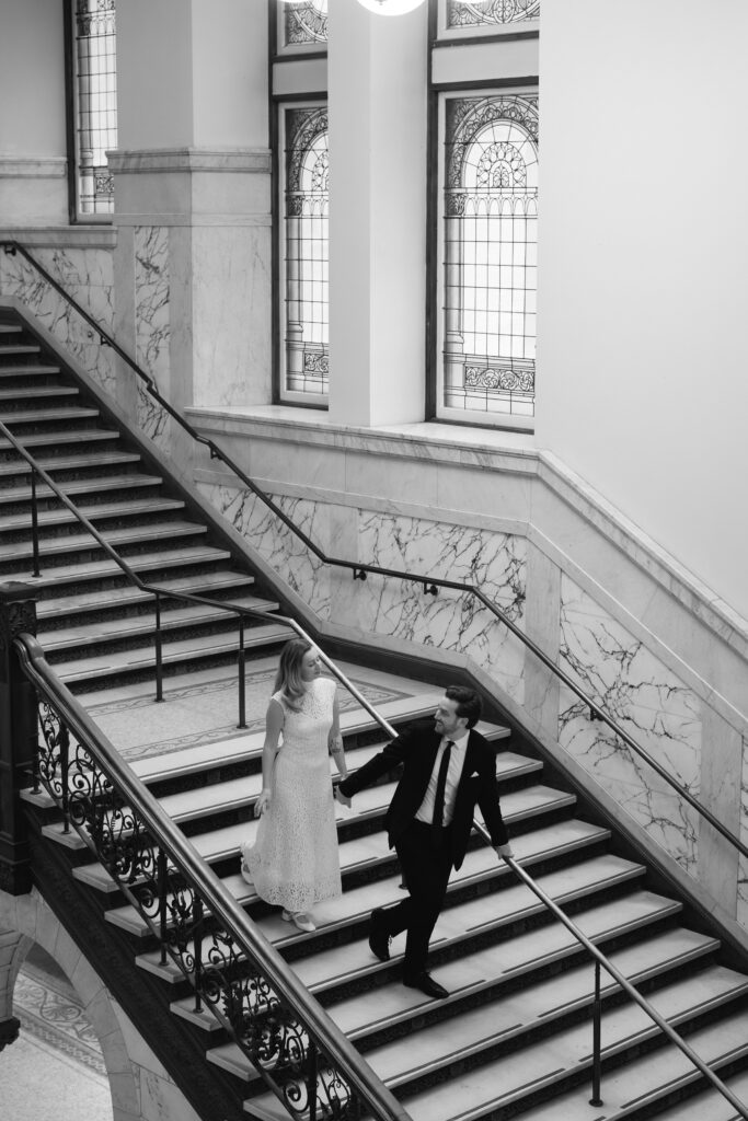Toronto Old City Hall Civil Ceremony Couple walking down stairs