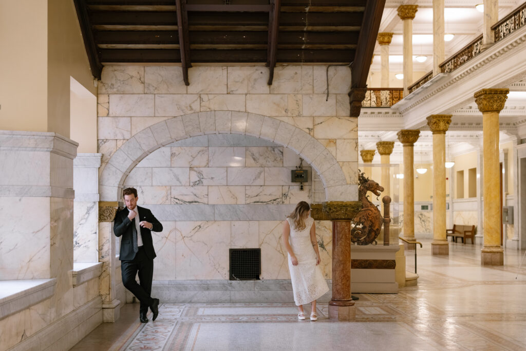 Toronto Old City Hall Civil Ceremony Couple fiixing their outfits