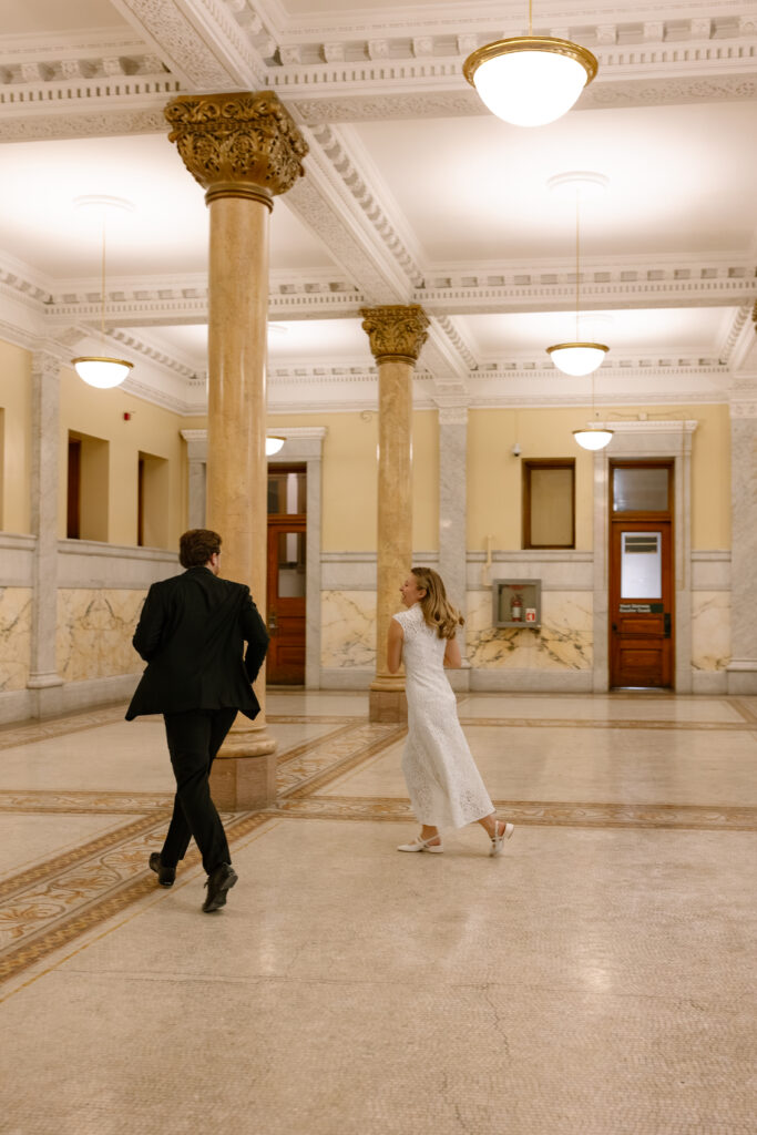 Toronto Old City Hall Civil Ceremony Couple chasing each other