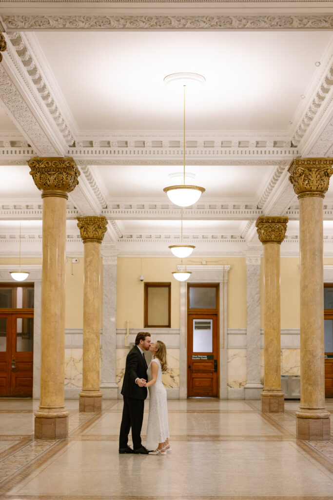 Toronto Old City Hall Civil Ceremony Couple kissing in hallway