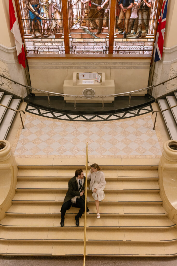 Toronto Old City Hall Civil Ceremony Couple sitting on staircase
