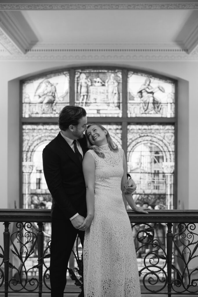 Toronto Old City Hall Civil Ceremony Couple standing infront of stain glass