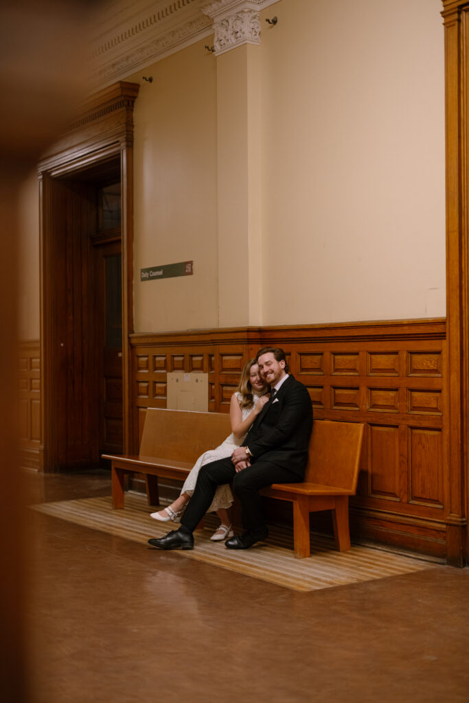 Toronto Old City Hall Civil Ceremony Couple sitting on bench