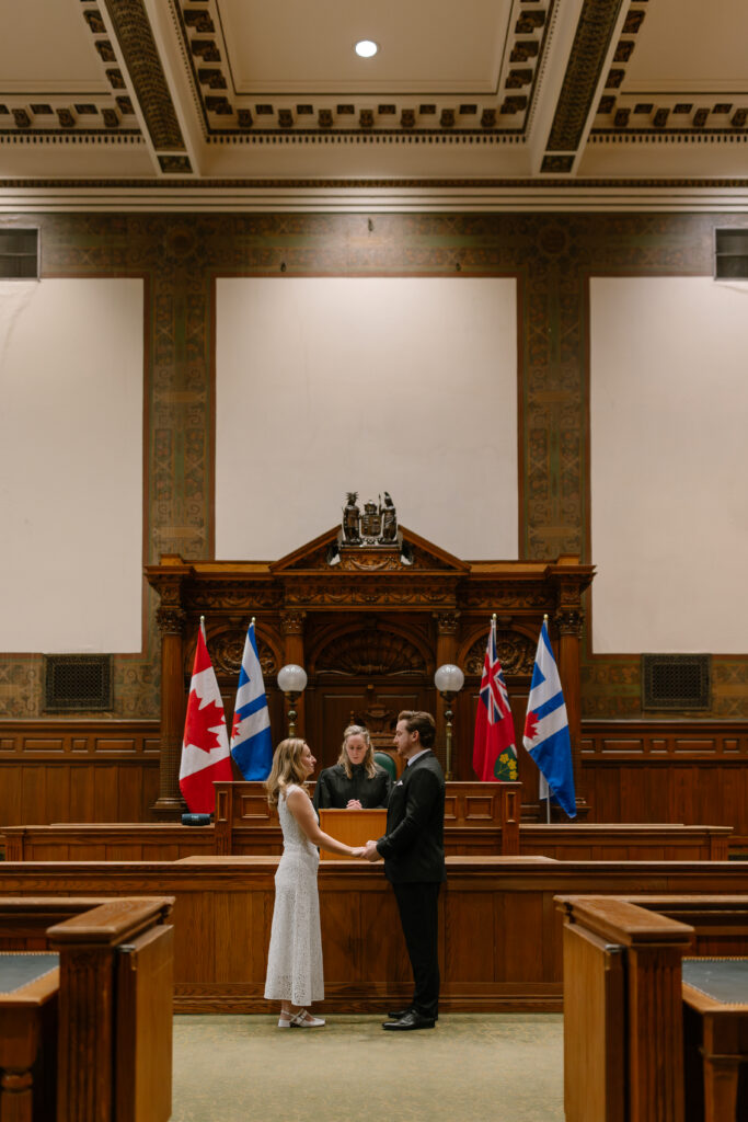 Toronto Old City Hall Civil Ceremony Couple standing at ceremony with Justice of the Peace