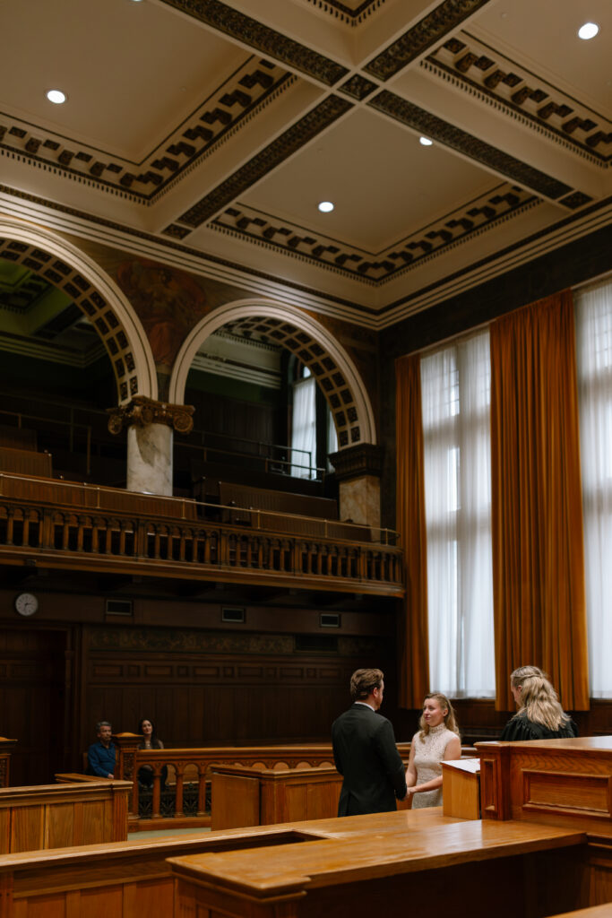 Toronto Old City Hall Civil Ceremony Couple standing at ceremony with guests