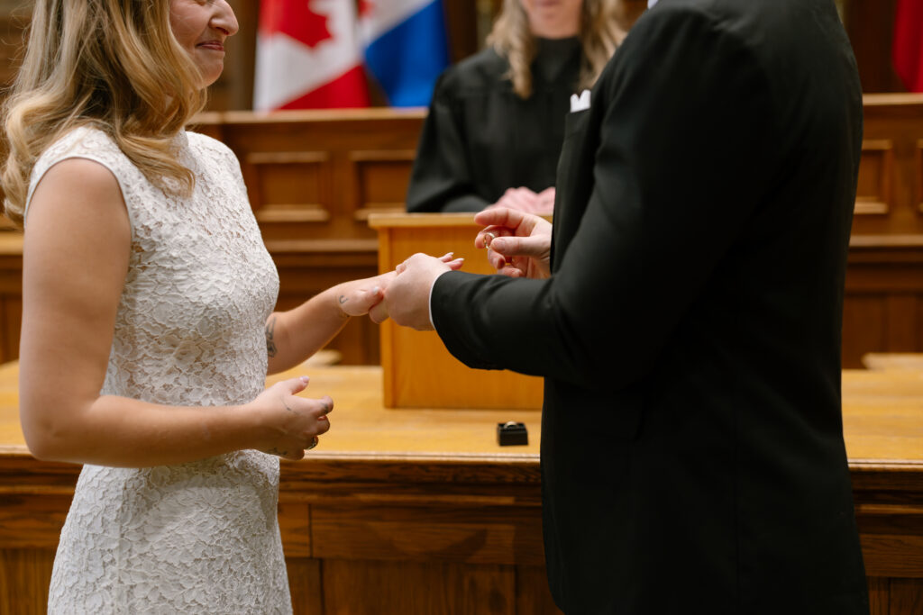 Toronto Old City Hall Civil Ceremony Couple exchanging rings