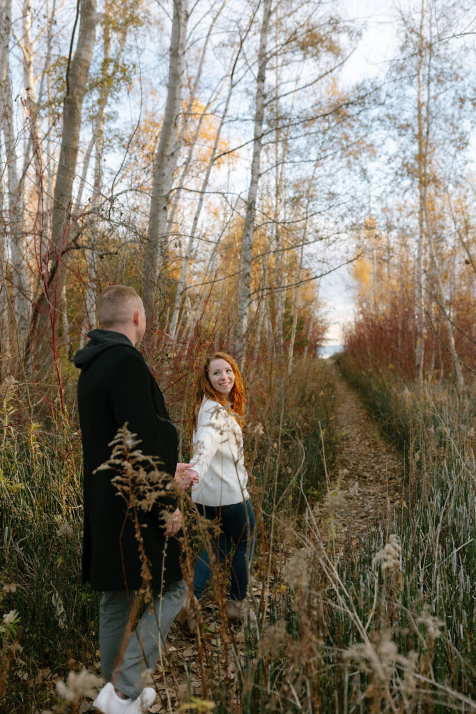 Toronto Island proposal couple walking into forest