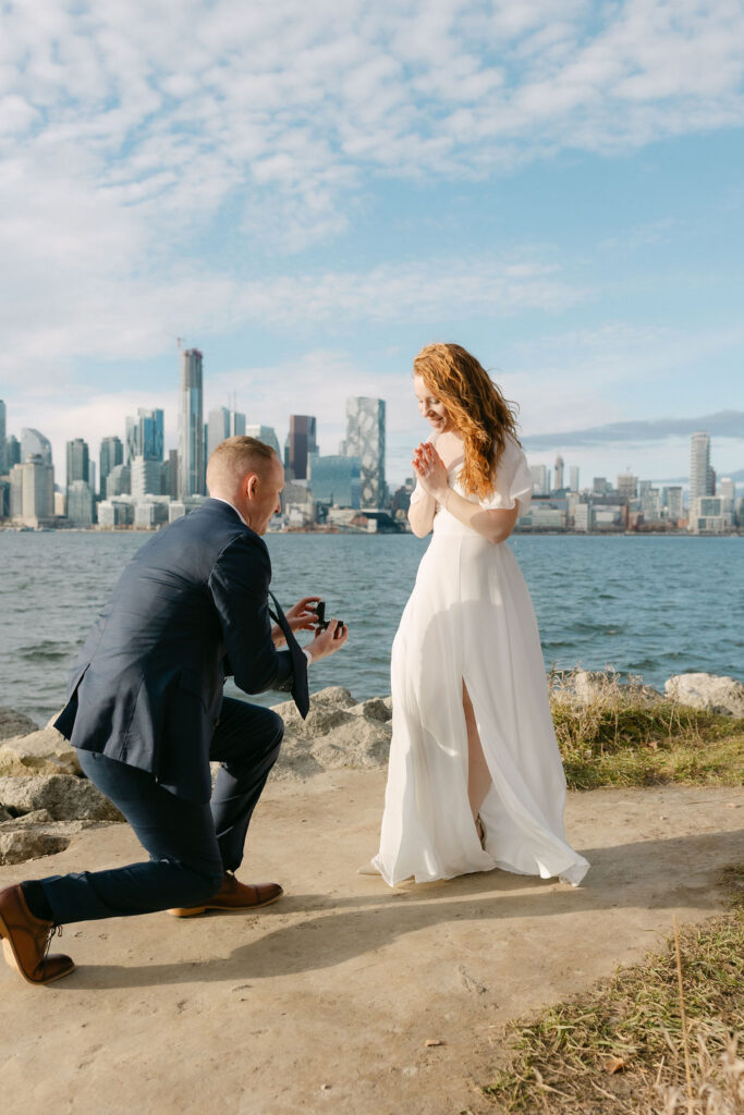 Man kneeling with a ring proposal on the Toronto Island