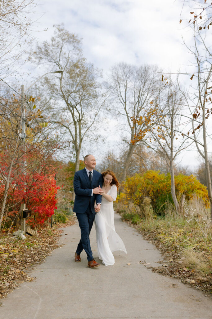Toronto Island proposal couple walking while laughing